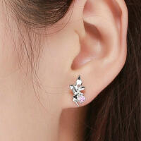 Special fairy stud earrings made of 925 silver sit on a...
