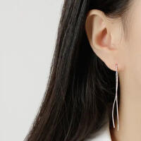 Minimalist earrings in wave shape pull-through made of...